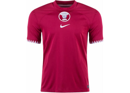 Nike Qatar 2022/23 Stadium Home Dri-FIT Soccer Jersey Desert Maroon/White - authentic Nike apparel